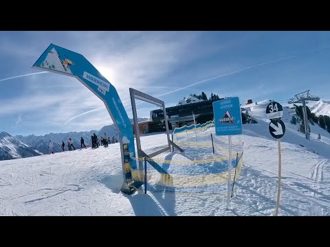 Snowboarding on the Harakiri black slope Ausria’s steepest ski run 78% - Mayrhofen