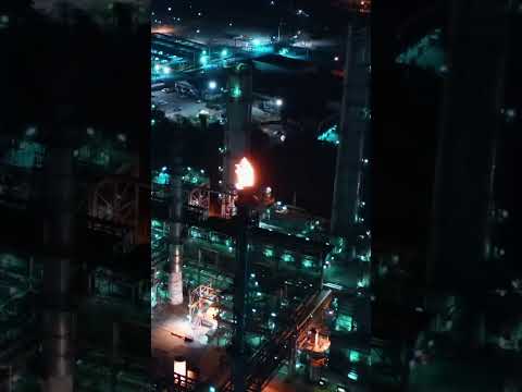 Flare at a Refinery at Night - Drone Aerial Footage