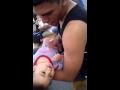 Big bro tickles the baby at Clovis High