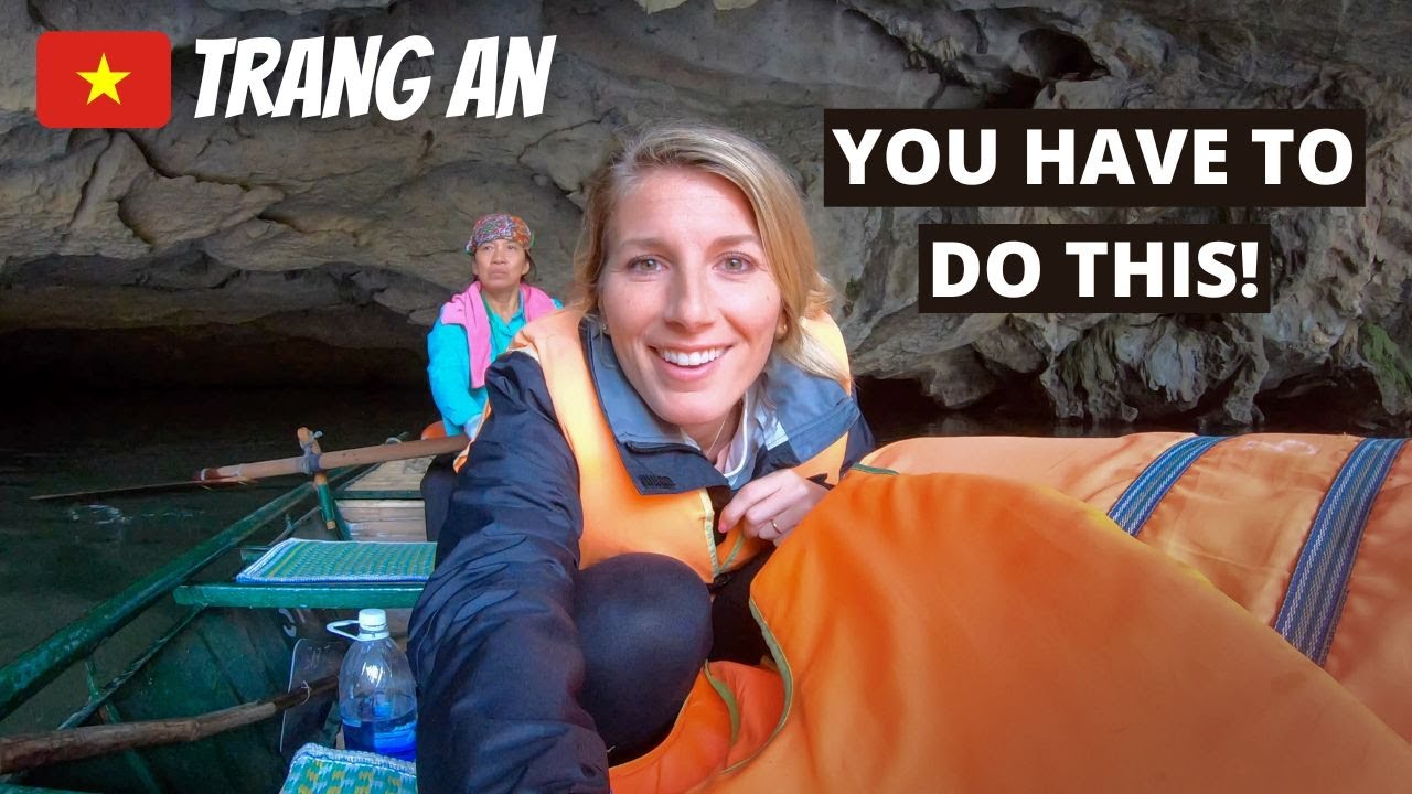 A duo embarks on Trang An Boat tour.