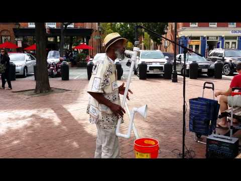 Man playing saxophone made from PVC pipe