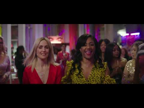 Trailer coda frame: partners reunited, pop anthem energy into credits