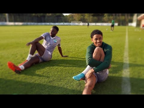 Jonathan Sahr Morsay and Kamil A. Conteh speaking after Friday's training session.
