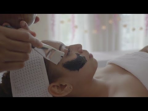 BLACK MASK | How To Apply Tutorial | Young beautiful woman receives charcoal spa therapy in Thailand