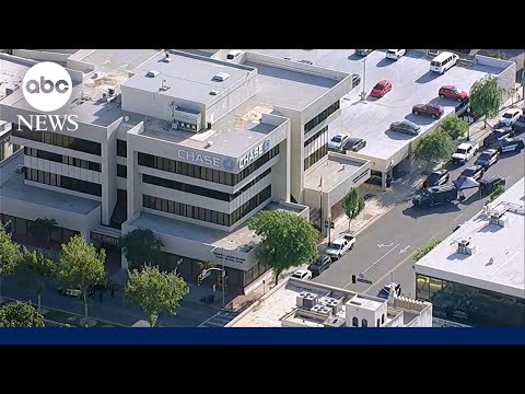 Man barricades himself inside bank with hostages after bomb threat