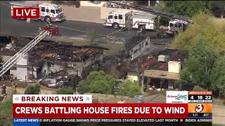 Crews battle wind-driven fire in Mesa neighborhood
