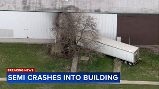 Semi crashes into building in West Chicago: police