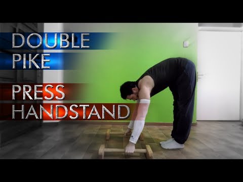 DOUBLE PIKE PRESS TO HANDSTAND