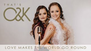 Musik-Video-Miniaturansicht zu Love Makes The World Go Round Songtext von That's O&K