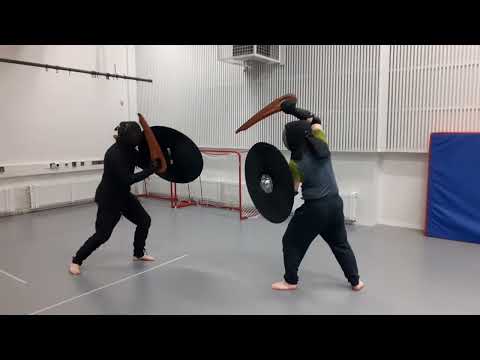 Testing weapon simulators in safety gear 1 - Blades and shields.