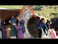 Joy in magical cave:support of cameraman to grandmother and two orphans in building dream cave
