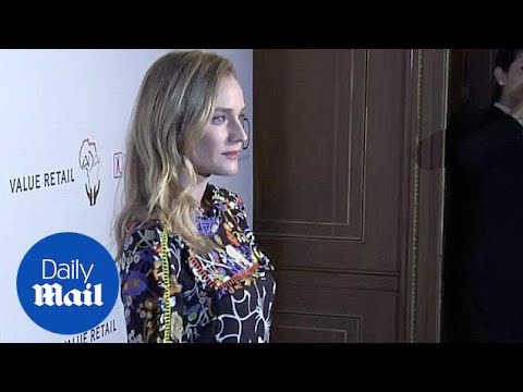 Diane Kruger holds her bag like a briefcase at charity event - Daily Mail