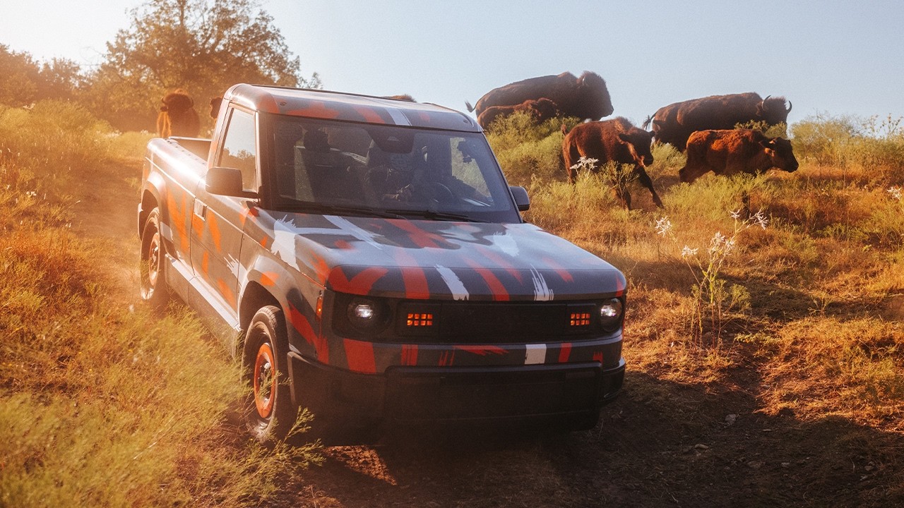 Slate electric pickup truck working on a bison ranch