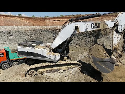 White Caterpillar 375 Excavator Loading Mercedes & MAN Trucks