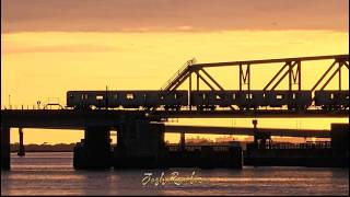 New York City trains at sunset over Jamaica Bay