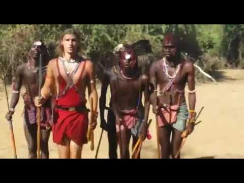 Maasai morans with a Eurolean enjoying the traditional dance