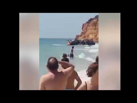 Bathers Witness Migrant Invaders Storming Beach at 5 Star Resort of Sancti Petri, Cadiz, Spain