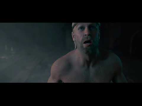 Beowulf (2007) official trailer still: motion-captured hero framed in torchlight