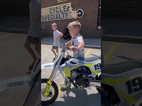 Walking out a new Husqvarna TC65 out of the showroom.