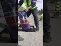 Road repair construction: Workers quickly repair roads pothole using silicon asphalt cold patching