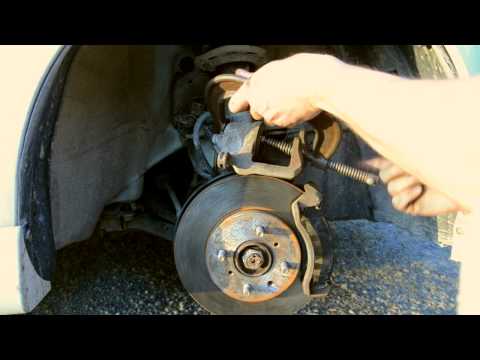 Part of a video titled Change front brakes, pads and rotors, Honda Fit (2007) - YouTube
