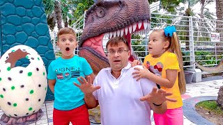 Diana and Roma learn about dinosaurs and play with different illusions at the museum