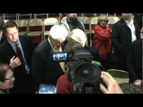 Newt Gingrich shakes hands and kisses babies in Meredith