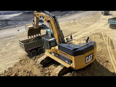 Caterpillar 365C Excavator Loading Trucks