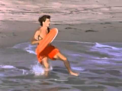 Baywatch-Pamela Anderson and David Sharvet in action on the beach