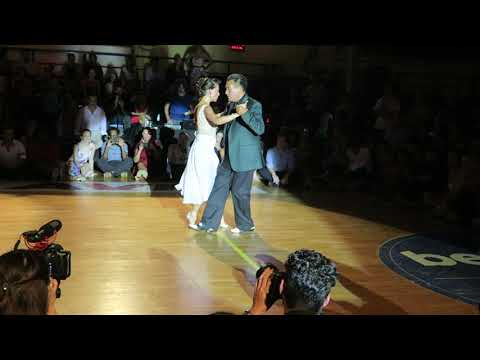  Juana Sepulveda  and  Mariano Frumboli  are  dancing  to  a  nontraditional song  at  A los amigos tango festival  in  2019