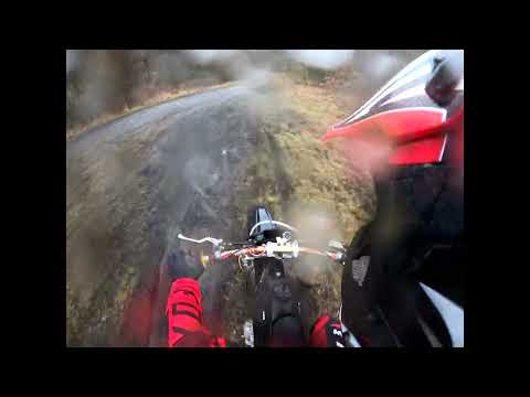 me riding my 10ten 250rx through the trails