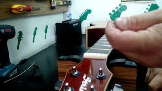 Como instalar cordas de guitarra e violão aço