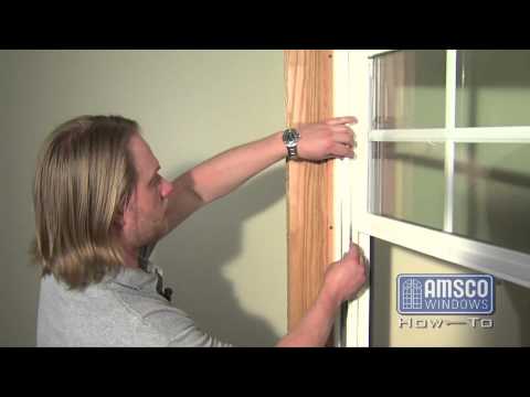 Double hung window balance spring replacement