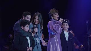 The star Asala, accompanied by her children, from the Nile Business City inauguration ceremony