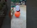 Boy Bouncing On Orange Hopper Ball