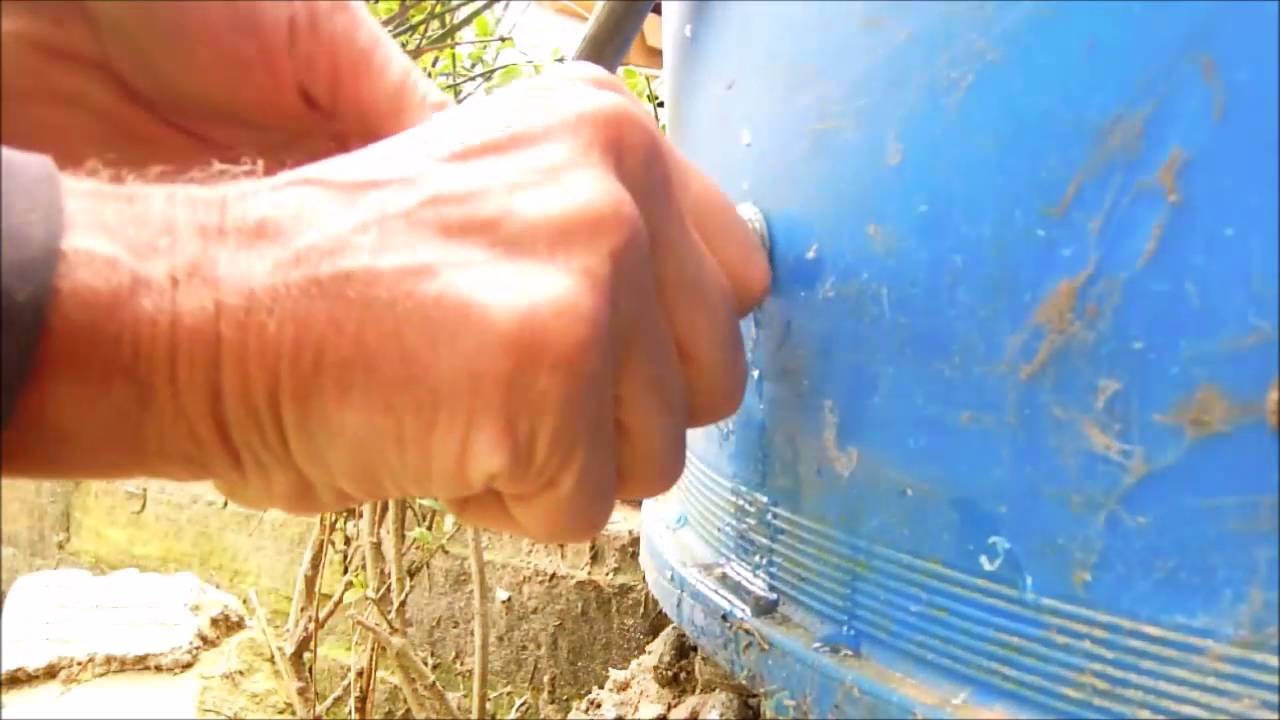 Watch video Fitting Poundland plastic tap to garden water butt Now Fitting Poundland plastic tap to garden water butt