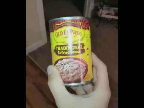 Cat rapidly hits can of refried beans