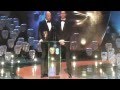 Tom Hiddleston and Mark Strong presenting an.