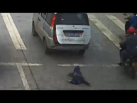 Child run over after falling from moving car