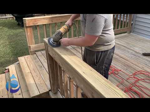 Sanding a deck to remove splinters and prep for stain