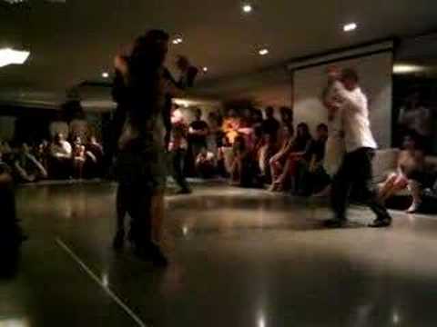  Oscar Martinez Pey  and  Carolina Castiella Torres  are  dancing  to  a  tango