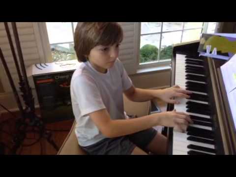 Santino age 9 writing a riff on the piano