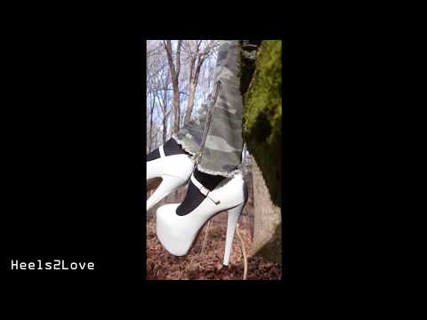 Extreme 6 inch White Patent Maryjane Stilettos dangling from rock in forest