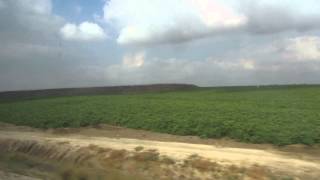 preview picture of video 'Vegetable fields in the desert in Israel as seen from the train window to Beer Sheva'