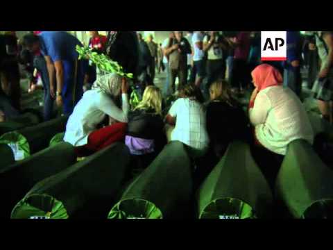 Remains of more than 400 newly identified massacre victims buried