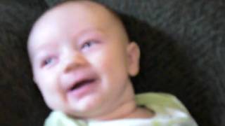 Samson giggling at his big brother