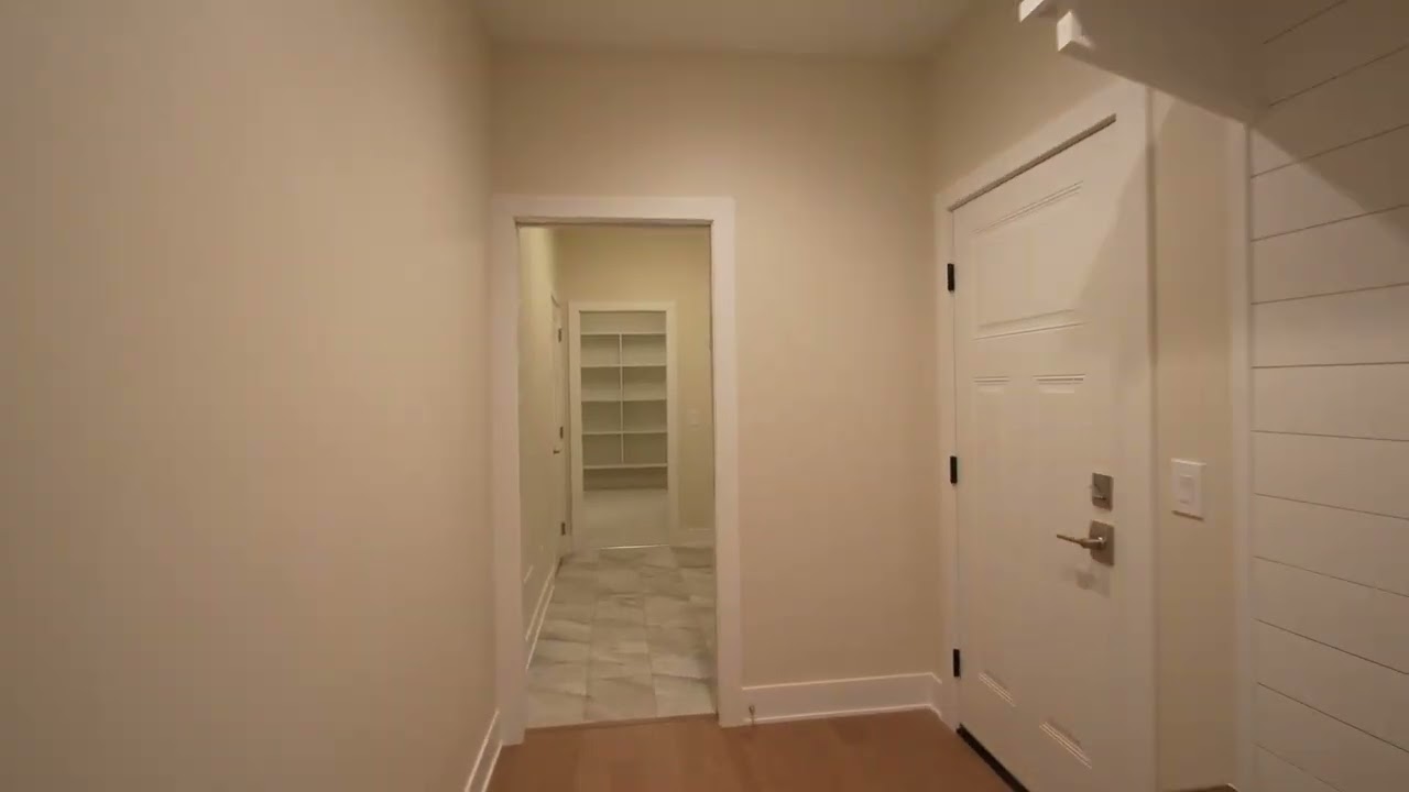 Julie Picknell touring a Cambridge M model home