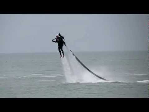 Dan Cunliffe flying a jet pack over Tampa Bay.