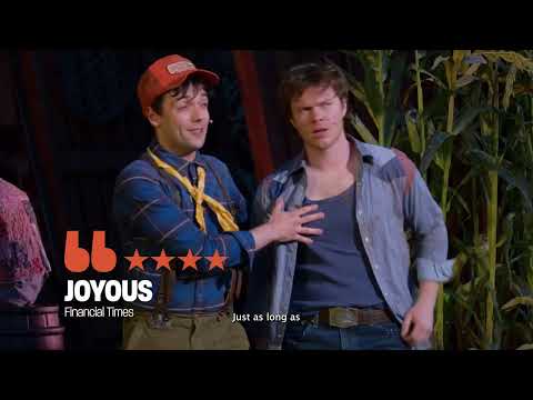 Shucked trailer still: cast dancing on a rustic barn set with corn motifs