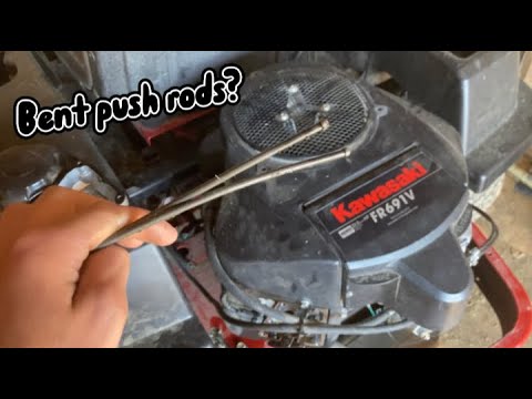 What can cause bent push rods on a lawnmower?